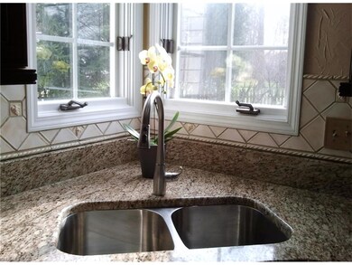 Kitchen sink overlooks the backyard.