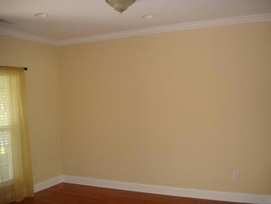 Formal Living or Dining Room with Hardwood Flooring, Great Trim Package, and Open Floor Plan