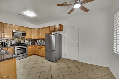 Kitchen featuring appliances with stainless steel