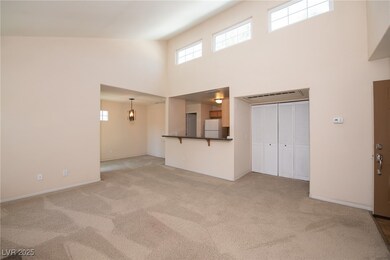 Unfurnished living room with baseboards, light col