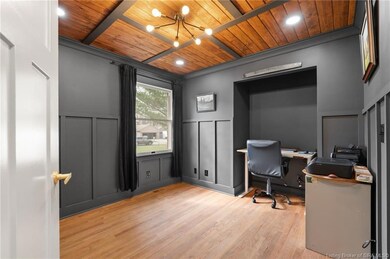 Bedroom 2 w/ accent walls and wood ceiling!