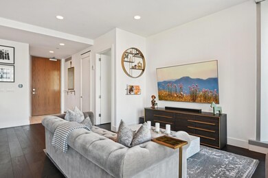 Living room featuring dark hardwood / wood-style f