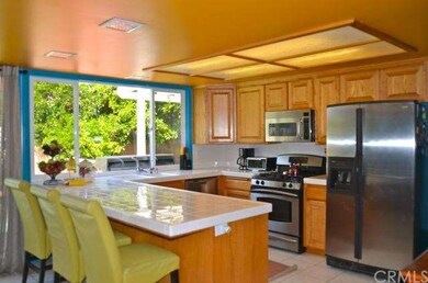 Kitchen has Stainless Steel Appliances and Breakfa