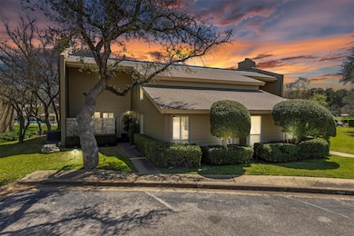 View of front of property with a shingled roof, u