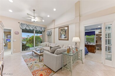 Living area with lofted ceiling, recessed lighting, ceiling fan, and light tile patterned flooring