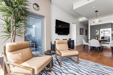 Living room with recessed lighting, baseboards, a