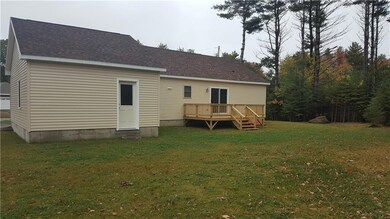 Exterior back with deck and Sliders!