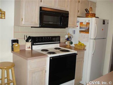 Kitchen. more of the kitchen w/stove & Microwave t