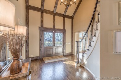 Grand Entry with a Double Beamed Ceiling and an Im