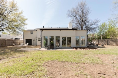 Back of property featuring a patio area, a fenced 