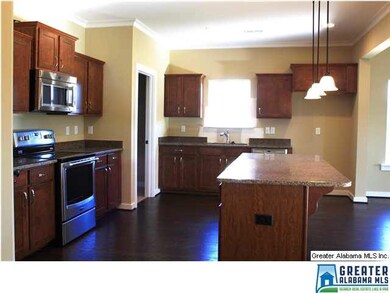 The kitchen has a large island perfect for serving
