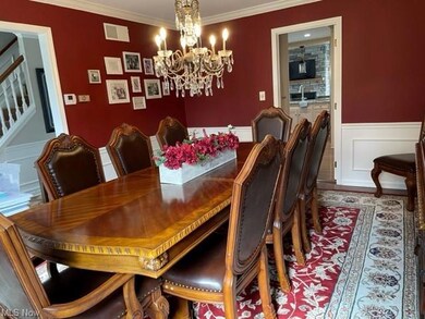 Formal dining room with wood floors