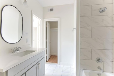 Primary bathroom with walk-in closet