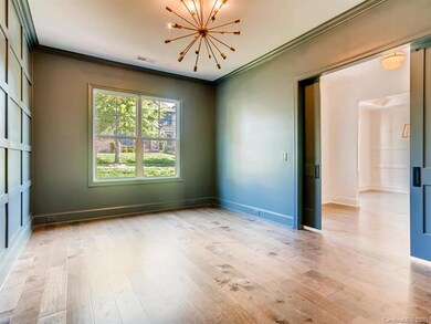 Study room with wall accent and beautiful hardwood
