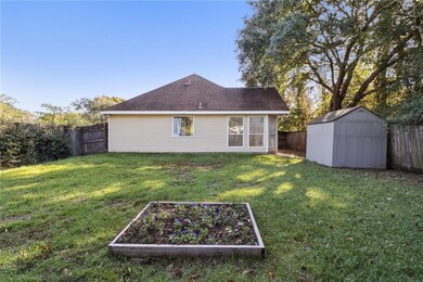 Large fully fenced yard w/ shed