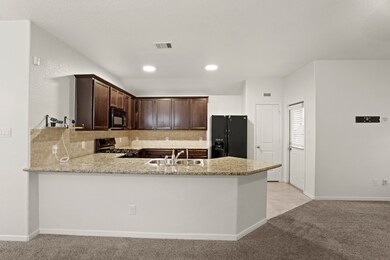 In this open concept design, the kitchen serves as the heart of the home, where meals are prepared, conversations flow, and memories are made.