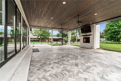Expansive covered deck with motorized shades
