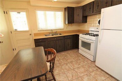 Kitchen with built in seating and access to side y