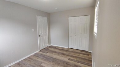 Unfurnished bedroom featuring light wood-type flooring and a closet