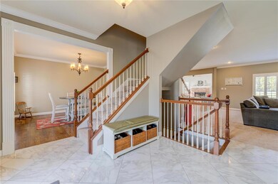 T stairs and stairs to lower level, open view into