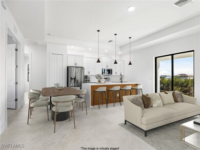 Living room with recessed lighting and visible ven