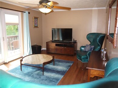 Living room has hard wood floors & French doors to
