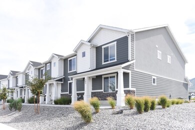 View of front of property with a porch, stone siding, and a residential view