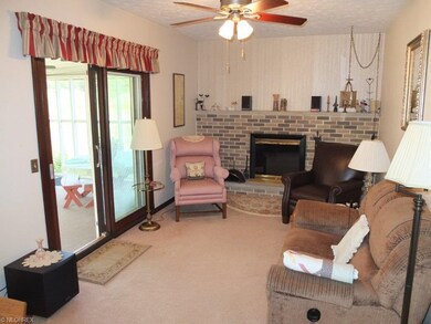 Inviting family room with fireplace and access to 