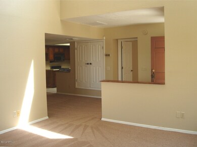 Living room to entry & dining area