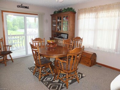 Dining room with slider to deck.