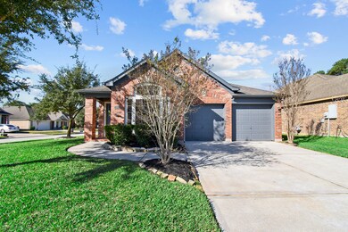 Well maintained yard, with luscious green grass!  Notice the architectural details on the home and two car garage!