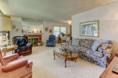 Fireplace in well kept living room. 
