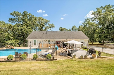 View of swimming pool with a patio and an outdoor living space