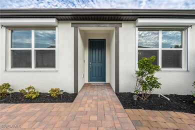 Doorway to property with stucco siding