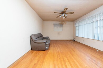 Living Room with hardwood floors and large window