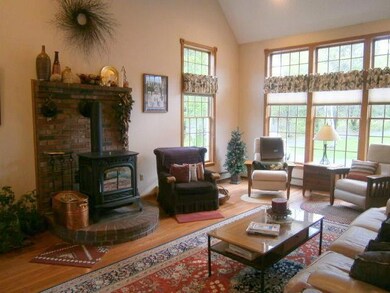 Living room with cathedral ceilings,...