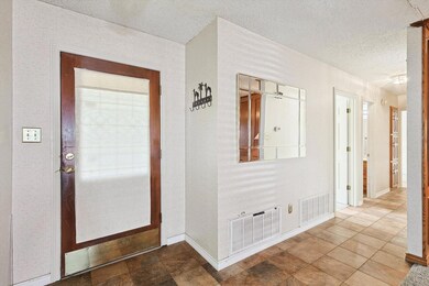 Entrance to property with a porch