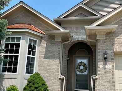Copper top bay roof. Covered arch front porch