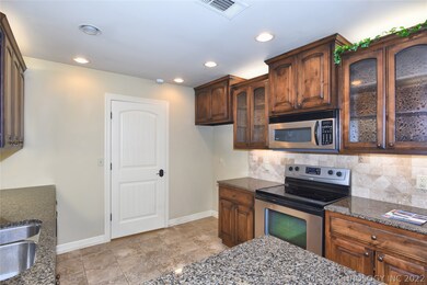 Tiled floors and stainless appliances. Beautiful d