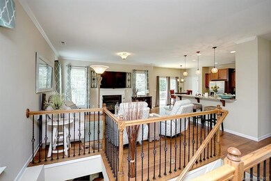 Living room with fireplace, adjacent to kitchen an