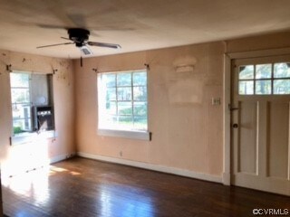 Interior space featuring ceiling fan and dark wood