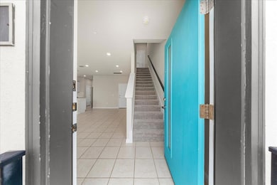 Staircase featuring tile patterned flooring, rece