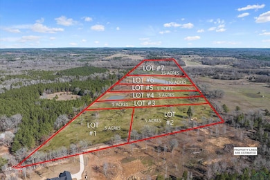 Overview of rural landscape featuring a forest and property parcel outlined