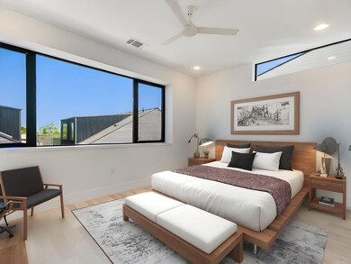 Bedroom with multiple windows, recessed lighting,