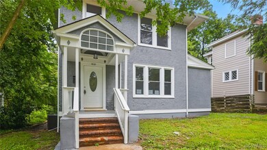 View of front facade featuring stucco siding, cent