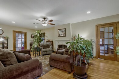 Living room has hardwood floors, fireplace, entran