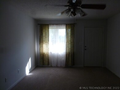 Living room looking at window and front door