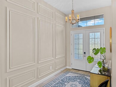 Beautifully adorned 12' walls and ceiling upon entering the home