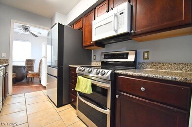 Kitchen featuring range with two ovens, white micr