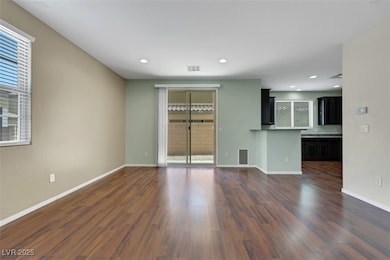 Unfurnished living room with dark wood-style floor